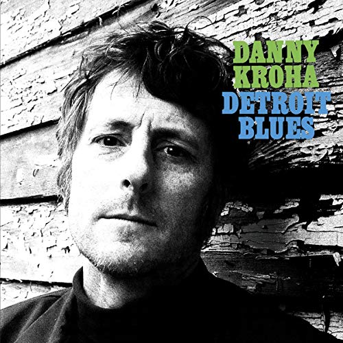 "Album cover with a black and white photo of a man and text."