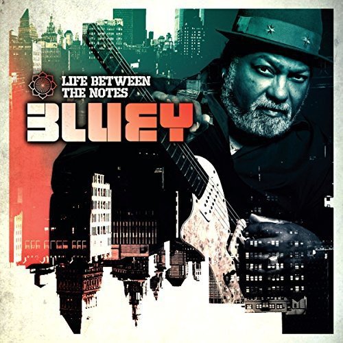 "Album cover with man holding guitar, cityscape background, and 'Bluey' text prominently displayed."