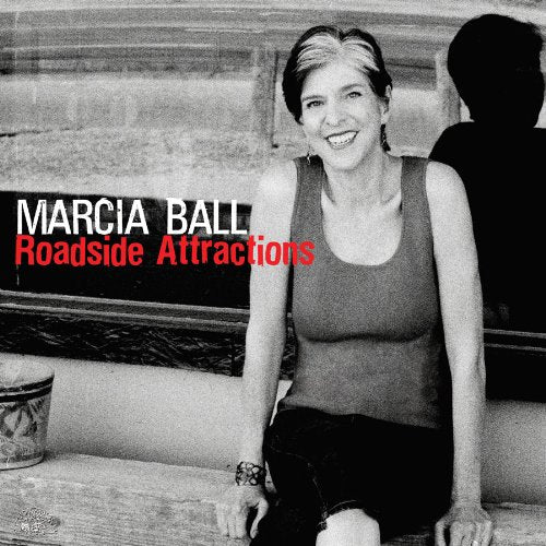 "CD cover featuring a smiling woman sitting on steps with text overlay."