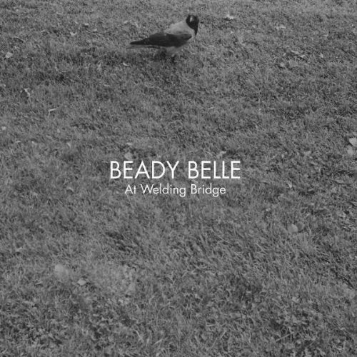Black and white album cover with a bird on grass, text "Beady Belle At Welding Bridge".