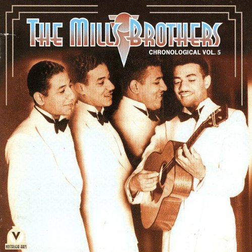 "CD cover with four men in white suits, one holding a guitar."
