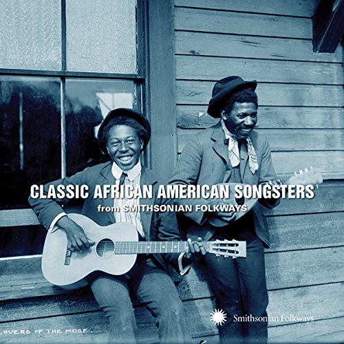 "CD cover with two men sitting on a porch, holding guitars."