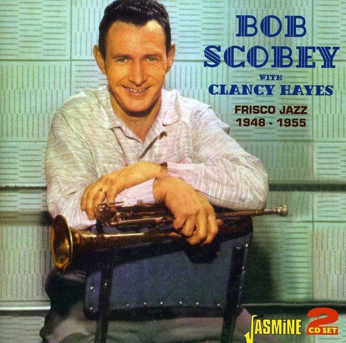 Man holding trumpet sits on chair, album cover with blue and yellow text.