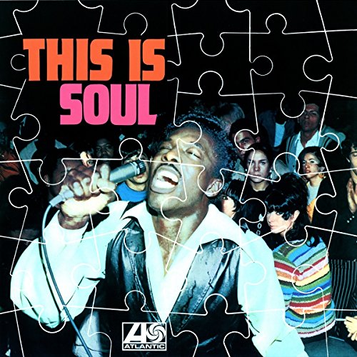 Vinyl album cover with a man singing into a microphone, surrounded by a crowd.