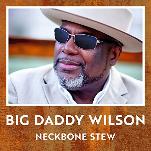 "Album cover with a man wearing a white hat and sunglasses, brown background."