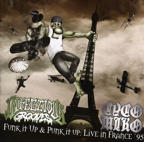 A CD cover featuring a man hanging from the Eiffel Tower with parachuters.