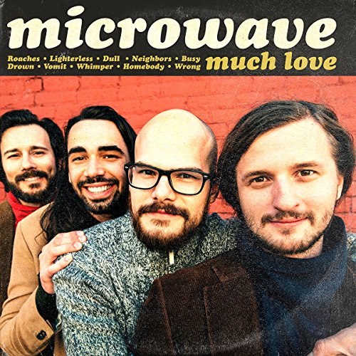 "Album cover with four smiling men in front of a red brick wall."
