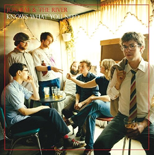 "CD cover featuring a group of men in a casual, indoor setting."