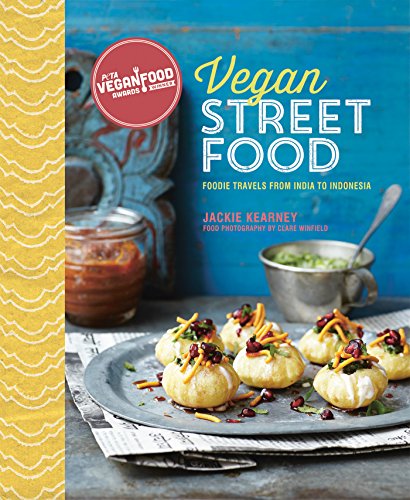 "Vegan cookbook cover featuring dumplings on a plate with condiments and blue background."