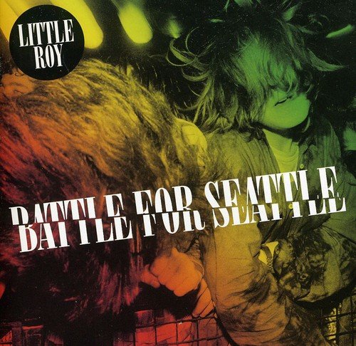 Album cover with a person in a fur coat, text "Little Roy" and "Battle For Seattle".
