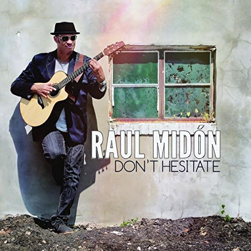 "Album cover featuring a man in a hat playing guitar beside a window."