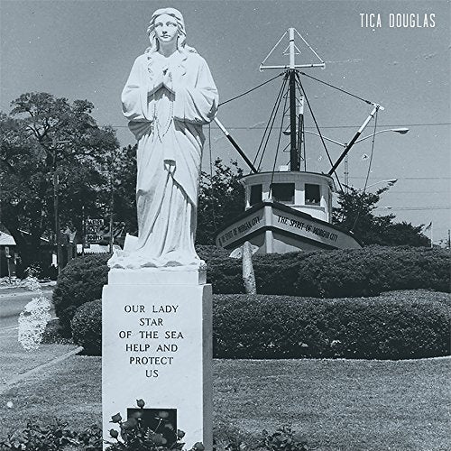 Black and white vinyl album cover featuring a statue of the Virgin Mary.