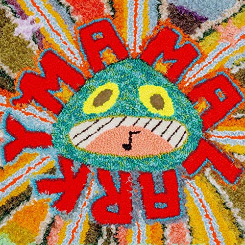 The image shows a colorful, fuzzy album cover with a cartoon face. For accessibility purposes, a suitable alt text could be: "Colorful, fuzzy album cover with cartoon face and red text."