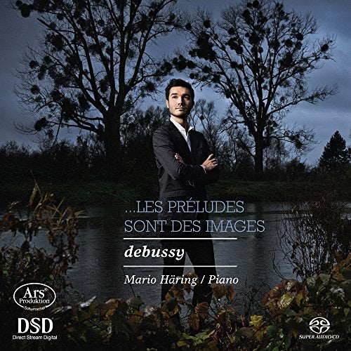 CD cover featuring a man in a suit standing by a pond.