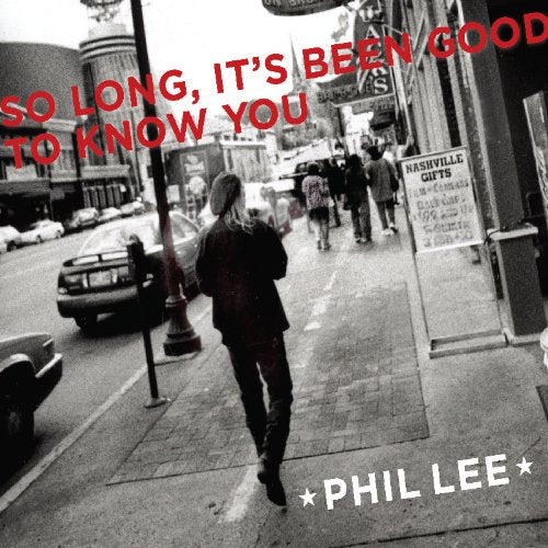 "Album cover with a black-and-white city street scene and red and white text."