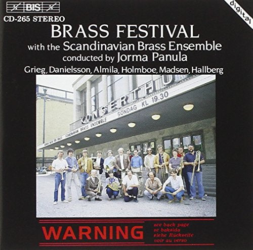 CD cover with a group of musicians outside a concert hall on a black background.