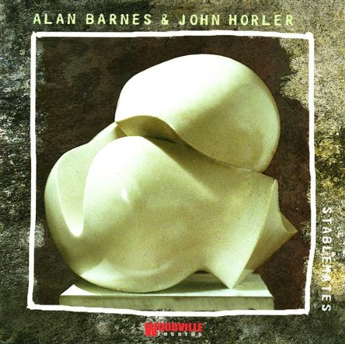Album cover with abstract sculpture, artist names, and title on textured background.