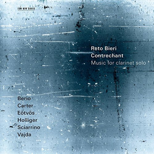 The image is a CD cover with a blue-grey, scratched metal background. #### Alt Text: "CD cover with blue-grey metal background, white and black text."