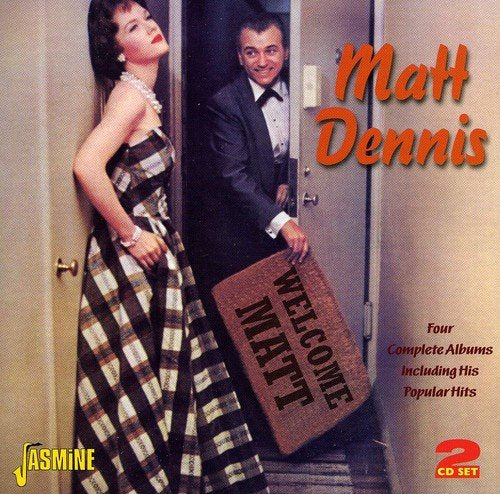 "Album cover with man holding 'Welcome Matt' doormat and woman in plaid dress."