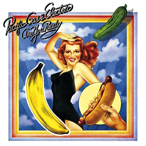 Album cover art: woman in black dress surrounded by banana, hot dog, and cucumber.