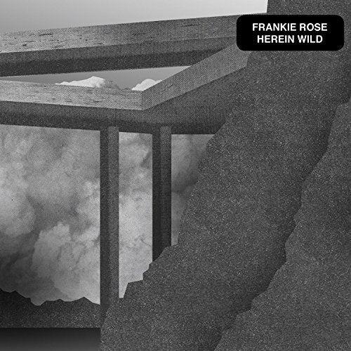 A black-and-white album cover featuring a fractured concrete structure with cloudy sky.