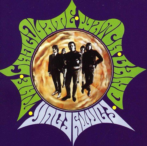 Purple album cover with yellow and white sunburst and band photo inside.