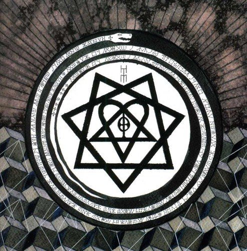 The image shows a DVD disc with a black and white geometric design. Alt text: Black and white DVD disc with geometric symbol on a reflective surface.
