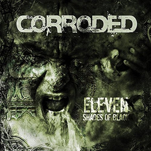 "Dark album cover with a screaming face and 'Corroded' and 'Eleven Shades of Black' text."