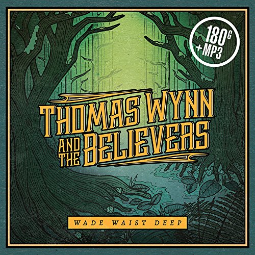 "Album cover with green forest scene, yellow text 'Thomas Wynn and the Believers', and 'Wade Waist Deep'."