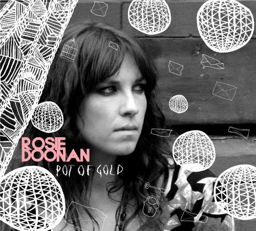 Black and white album cover featuring a woman surrounded by white geometric shapes and text.