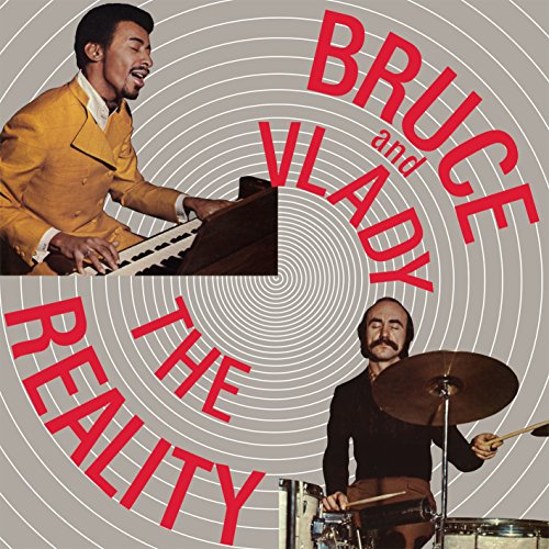 Album cover with two musicians, one playing piano and the other drums, against a spiral background.
