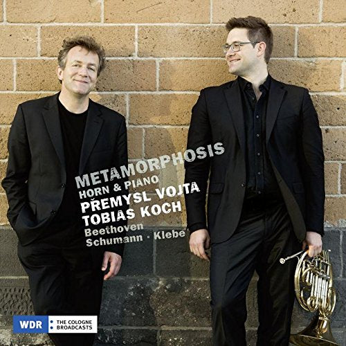 "CD cover with two men in black suits, one holding a French horn."
