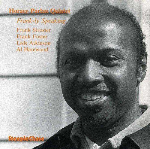 "Jazz album cover featuring a black-and-white portrait of a smiling man."
