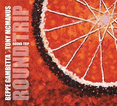 "Album cover with orange slice and white text on red background."