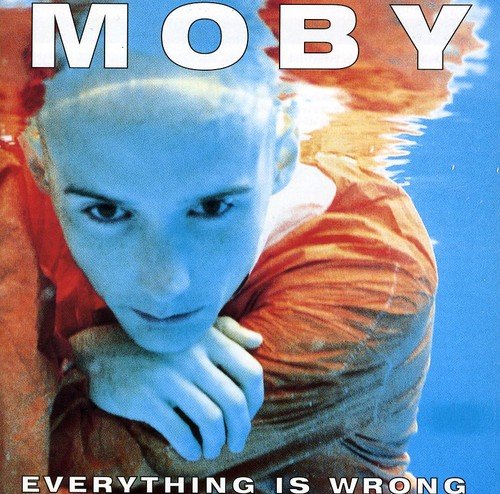 Moby album cover: a man with his head resting on his hand.