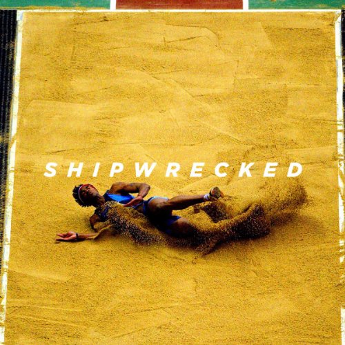 A man lies on sand, covered in sand, with "SHIPWRECKED" text overlay.