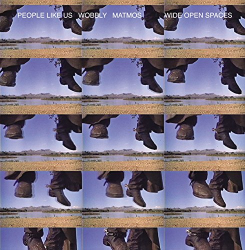 "Vinyl record cover featuring a collided image of boots in a desert landscape."