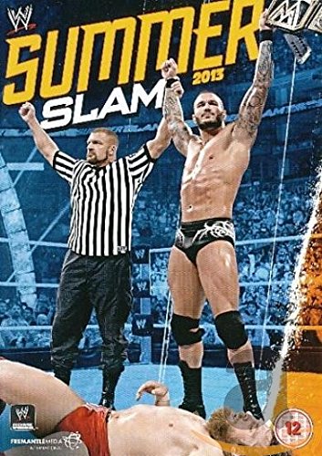 DVD case with wrestling scene: referee and victorious wrestler standing over a fallen opponent.