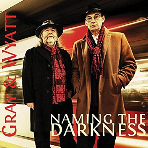 Album cover featuring two men standing in a subway with red and white text.