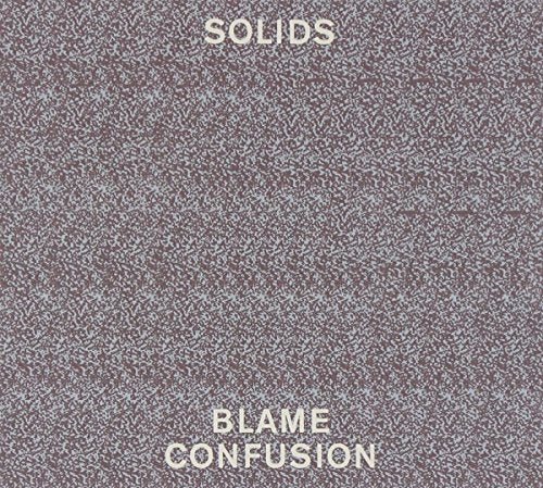 Album cover with "SOLIDS" at top and "BLAME CONFUSION" at bottom on a speckled brown background.