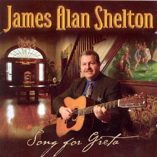 "Album cover featuring a man holding a guitar in a luxurious foyer."