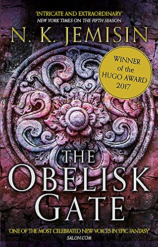 "The Obelisk Gate" book cover with intricate stone carving and Hugo Award badge.