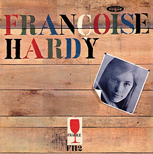"Album cover with Francoise Hardy's name, a black-and-white photo, and wooden background texture."