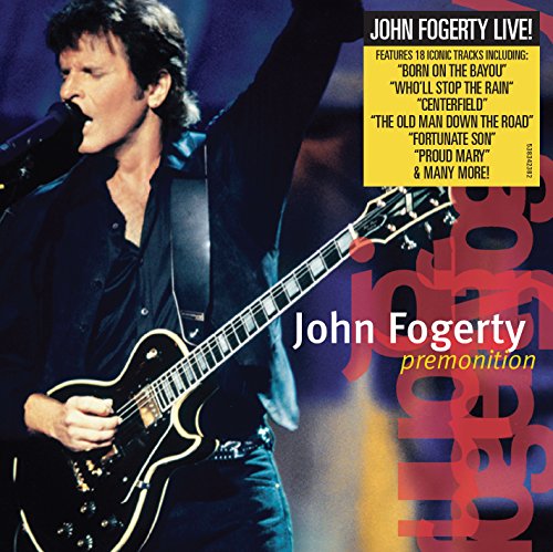 "John Fogerty on stage, playing guitar and singing into a microphone."