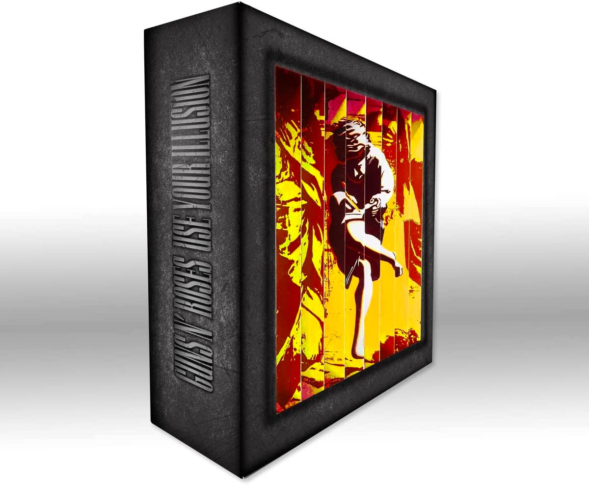 Guns N' Roses vinyl box set with records, artwork, and collectibles on a white background.