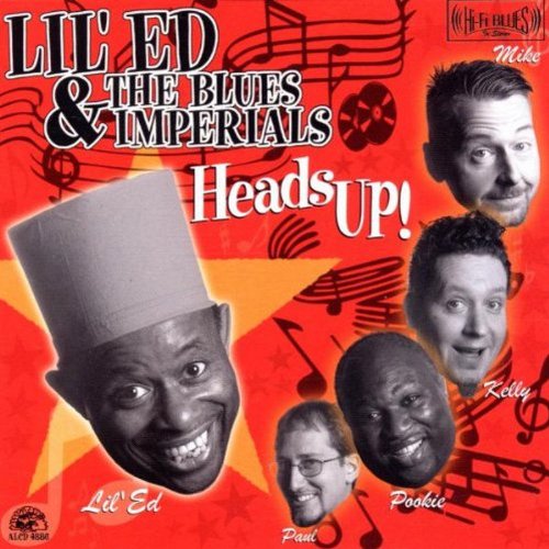"Album cover with red background, black musical notes, and four men's faces."