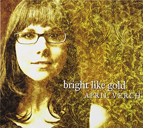 "Album cover with a woman's portrait and ornate gold background, titled 'bright like gold'."