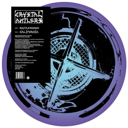 Vinyl record with purple border and abstract blue illustration on black background.