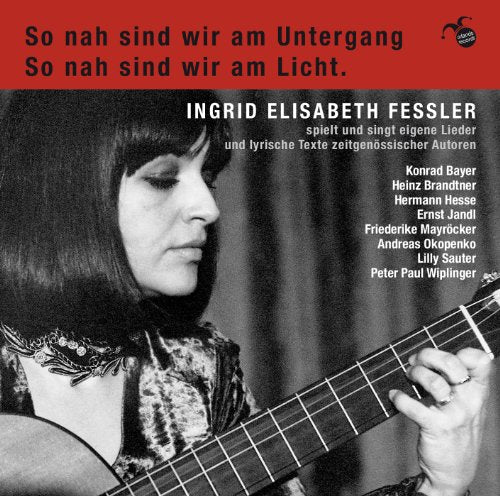 A black-and-white image of a woman playing guitar on a CD cover.