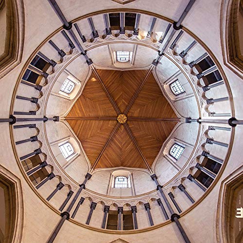 The image depicts a domed ceiling with a wooden center and beige walls. For accessibility purposes, a suitable alt text could be: "Image of a domed ceiling with wooden center."
